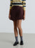Gonna-pantalone corta con pieghe e fibbia