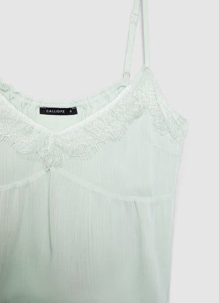 Top con balze e inserti in pizzo