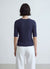 T-shirt in maglia a trecce con bottoni sulle spalle