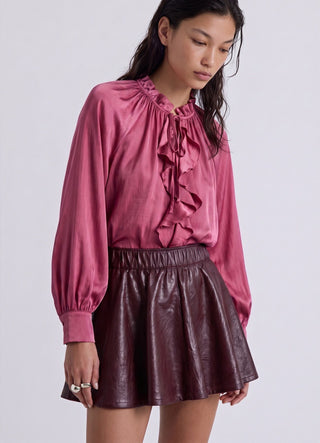 Chemise avec volants et liens au col