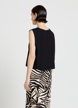 Sleeveless solid-colour blouse