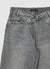 Jeans wide leg con patta asimmetrica