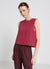 Sleeveless solid-colour blouse