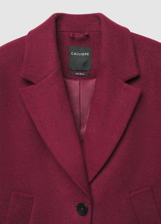 Long coat with single-button closure