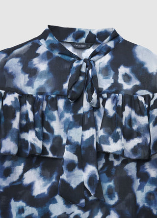 Blusa con fiocco e volant
