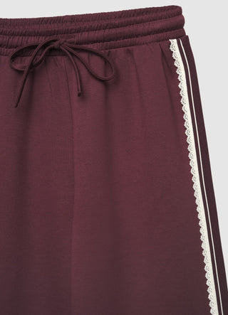 Palazzo trousers with drawstring and lace insert