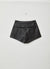 Shorts effetto pelle con tasche laterali