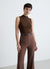 Sleeveless jumpsuit with high neck and belt
