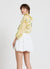 Blusa con volant e laccetti a stampa floreale