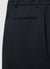 Trousers with pleats
