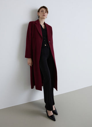 Long coat with single-button closure
