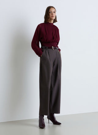 Blusa plissé con collo alto